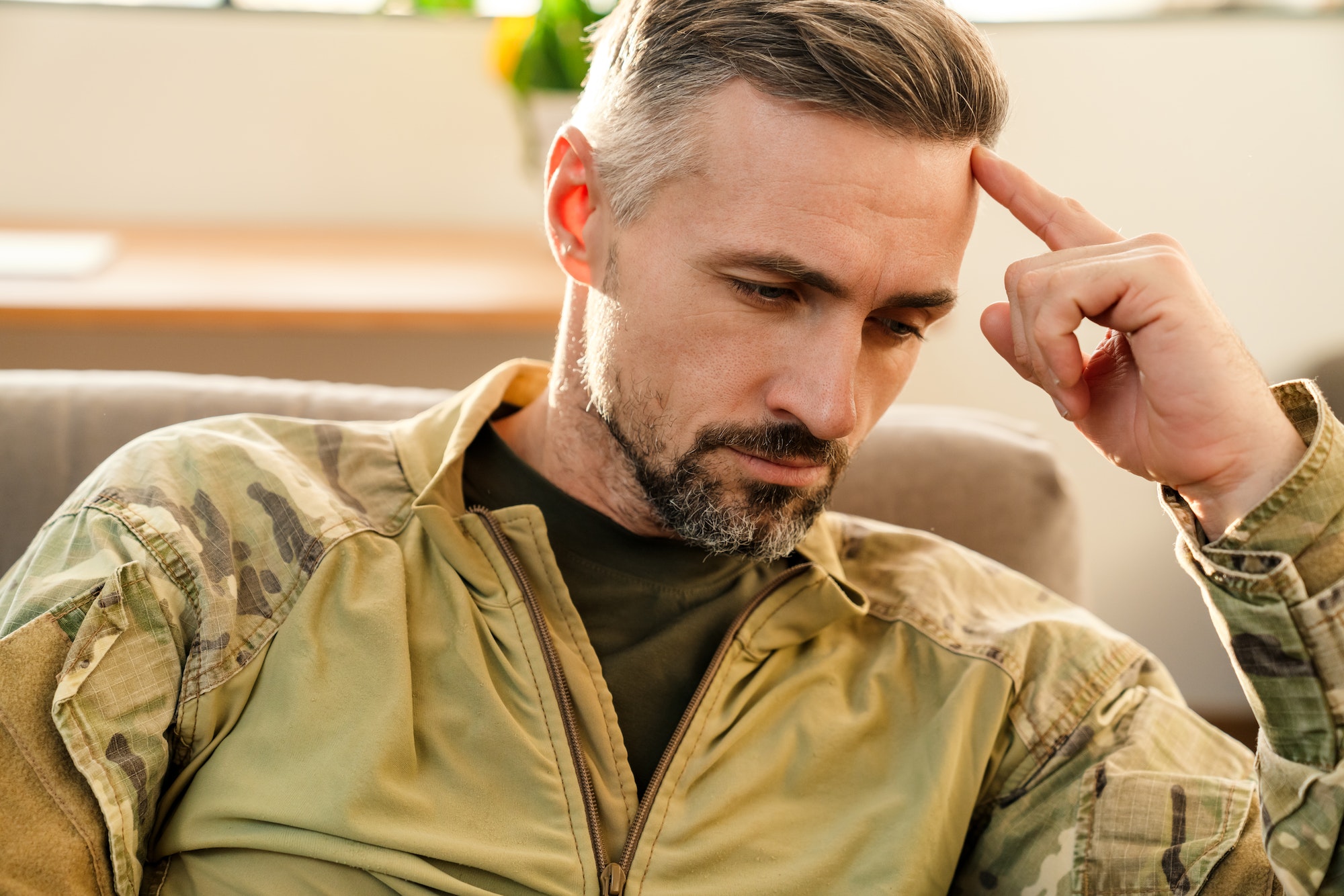 Depressed glum soldier during therapy