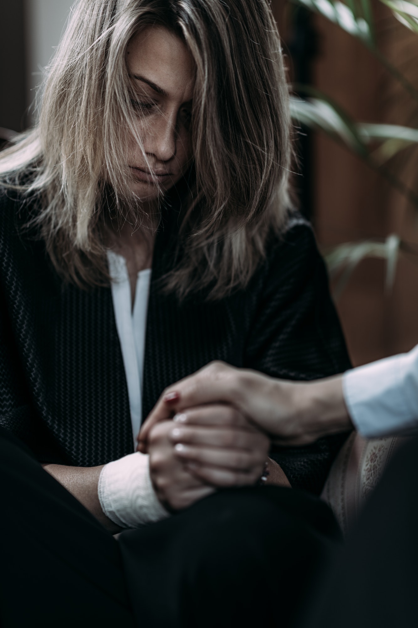 Psychotherapist Talking with Woman Suffering from PTSD.