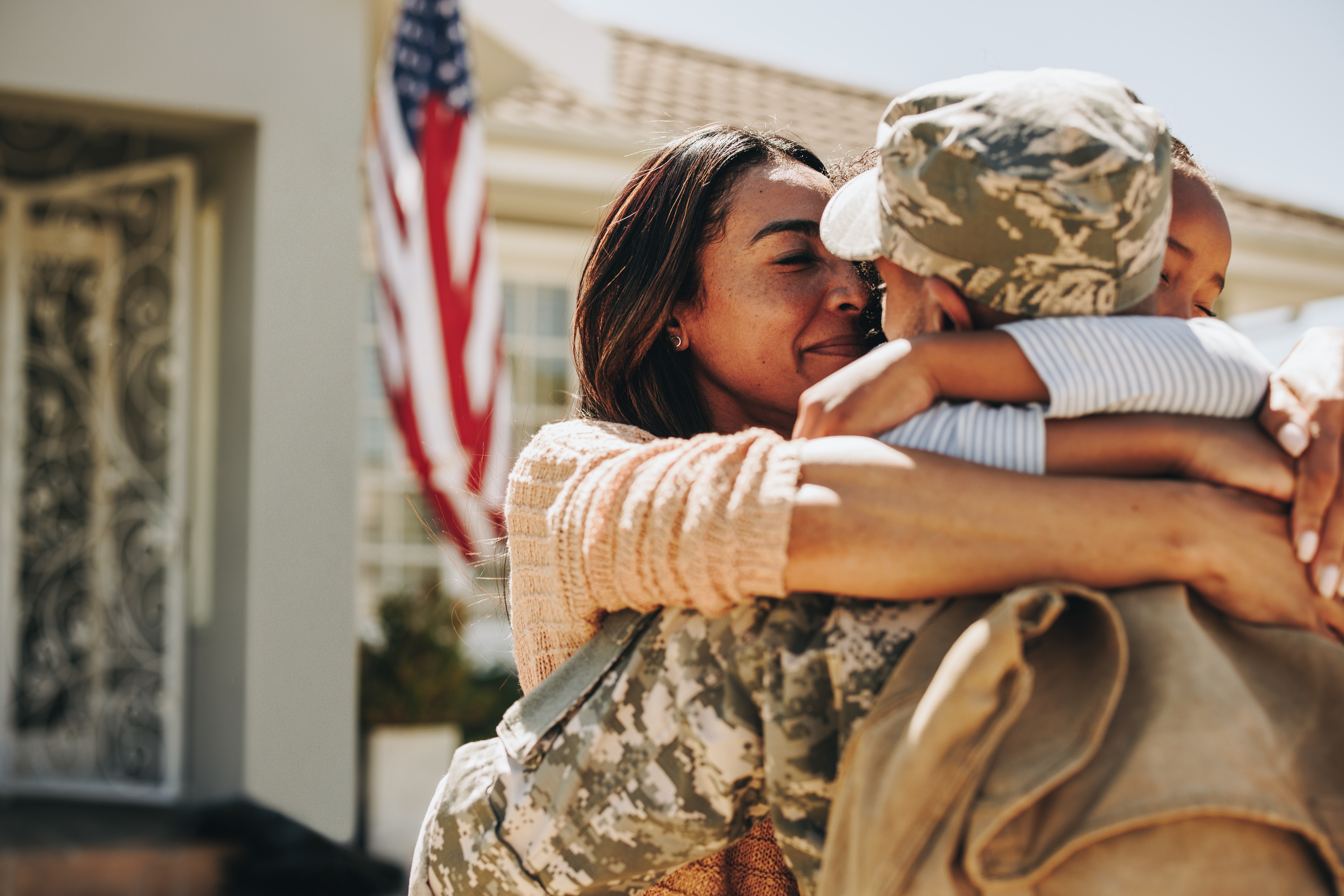 American Serviceman Saying His Goodbyes To His Family At Home.