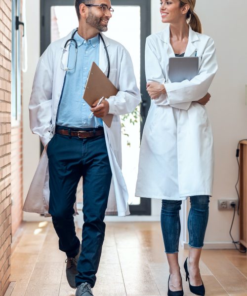 Confident female and male doctors talking about medical information in medical consultation.